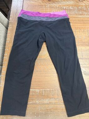Woman’s Black Capri Leggings with Purple Waistband